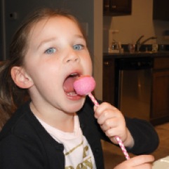 Wild child feeding on a strawberry pop in Columbus, OH.